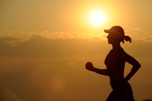 Woman running sunset